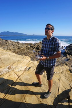 Me mapping the coastal outcrops from above